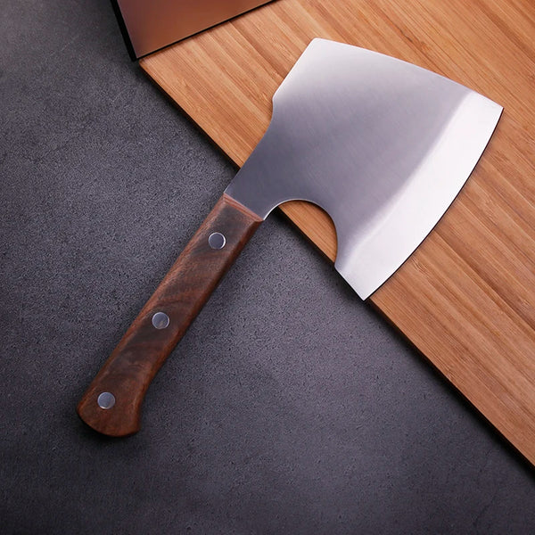 Handmade Forged Heavy Duty Cleaver on a wooden cutting board, showcasing its sharp blade and sturdy grip.
