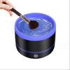 Electric Makeup Brush Cleaner Machine in use with a makeup brush being cleaned in water.