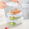 High Borosilicate Microwaveable Glass Lunch Box stacked with colorful meals and fresh ingredients ready for storage and heating.