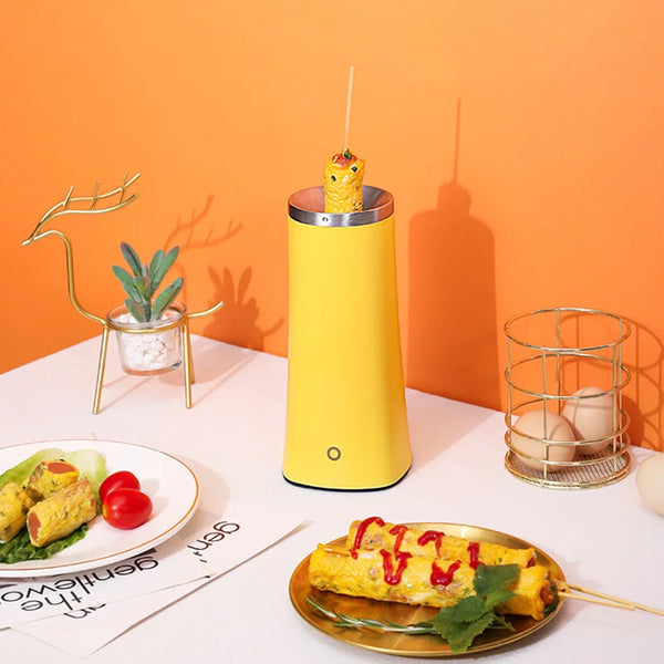 Image of an Automatic Egg Roll Maker in yellow, preparing egg rolls with garnishes and served on a plate.