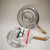Double-Layer Iron Silver Anti-Hot Heat Diffuser shown with packaging, designed to prevent overheating while cooking.