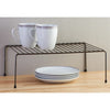 Single Layer Kitchen Metal Shelf Organizer with coffee mugs and plates, perfect for kitchen organization.