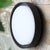 Waterproof Outdoor LED Corridor Ceiling Lamp mounted on a stone wall, designed for outdoor illumination.