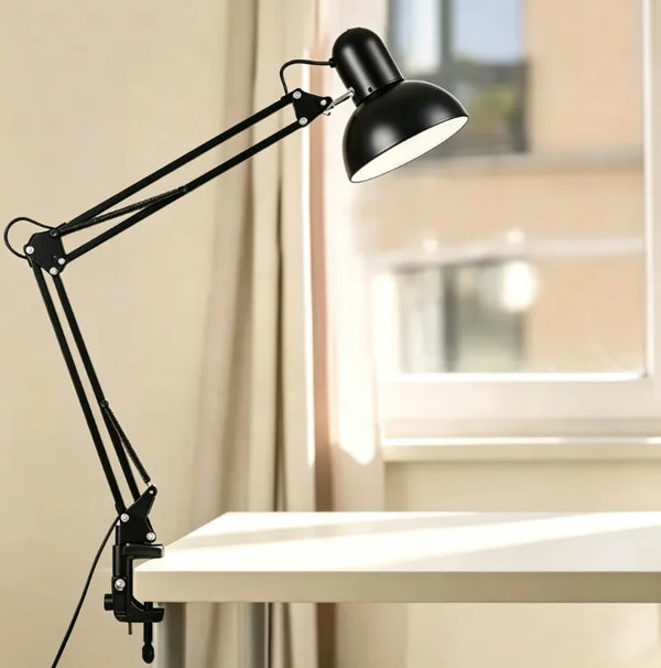 Flexible Adjustable Swing Arm Clip Desk Lamp positioned on desk, providing focused task lighting.