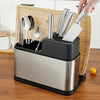 Stainless Steel Eco-Friendly Kitchen Tool set with utensils and knives on a wooden cutting board.