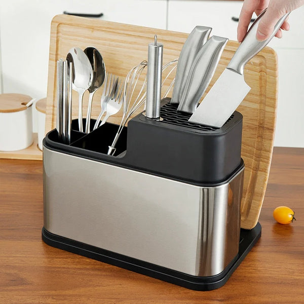 Stainless Steel Eco-Friendly Kitchen Tool set with utensils and knives on a wooden cutting board.