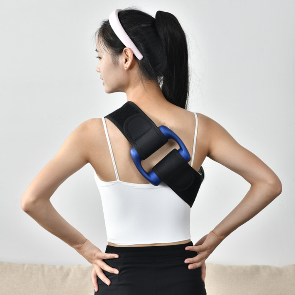 Woman using a Mini Portable Deep Tissue Fascial Massager Gun on her back for muscle relief.