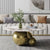 Modern Marble Coffee Table with Golden Orbs centerpiece in stylish living room decor.