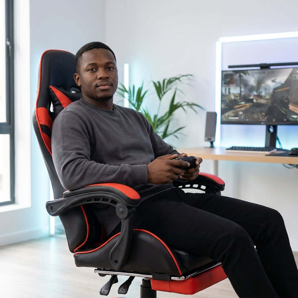 Person sitting in a Modern PU Leather Swivel Office Chair while gaming, showcasing comfort and style.