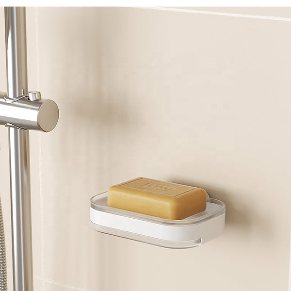Modern Wall-Mounted Shower Soap Holder with a soap bar in a sleek design on a smooth surface.