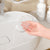 Hand holding a Modern Wall-Mounted Shower Soap Holder over a sink, showcasing its sleek design and functionality.