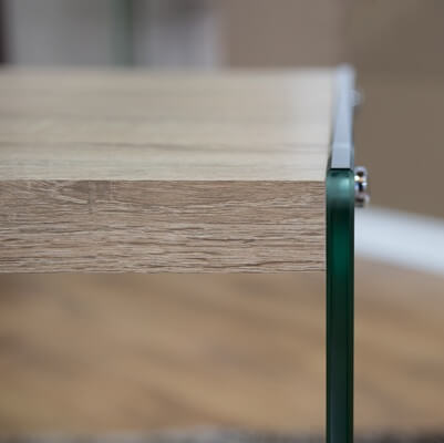 Close-up view of the Modern Wood & Glass Centre Coffee Table showing wood top and glass supports.