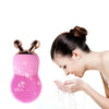 Woman using Multi-Functional Skin Firming Ultrasonic Electric device for facial cleansing and firming.