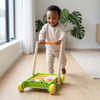 Toddler happily pushing the Natural Educational Toddler Push Cart Toy on wooden floor, promoting balance and confidence.