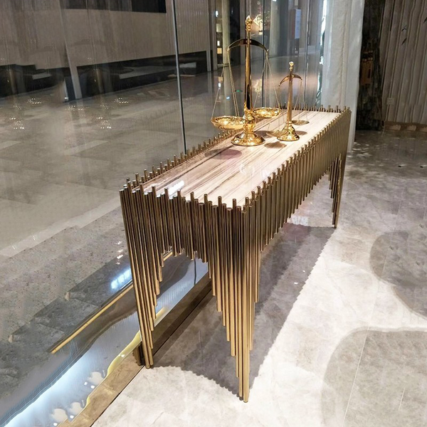 Luxury Stainless Steel Marble Entrance Table showcasing a geometric base with a marble surface and elegant decor accents.