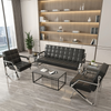 Steel Chrome Reception Sofa Suite in a modern lounge with glass table and shelves, ideal for office or home.
