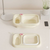 Portable Folding Baby Bath Basin – Lightweight Travel Wash Tub in light color with pink accents on a table.