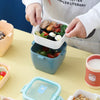 Person holding the Portable 800ml Kids Bento Lunch Box with Handle filled with healthy meals.