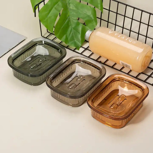 Portable Eco-Friendly Soap Tray in three colors: green, gray, and amber, designed to keep soap dry and usable.