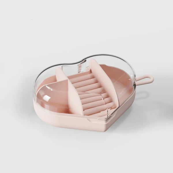 Portable Heart-Shaped Acrylic Jewelry Storage Box showcasing the organized compartment for rings and jewelry.