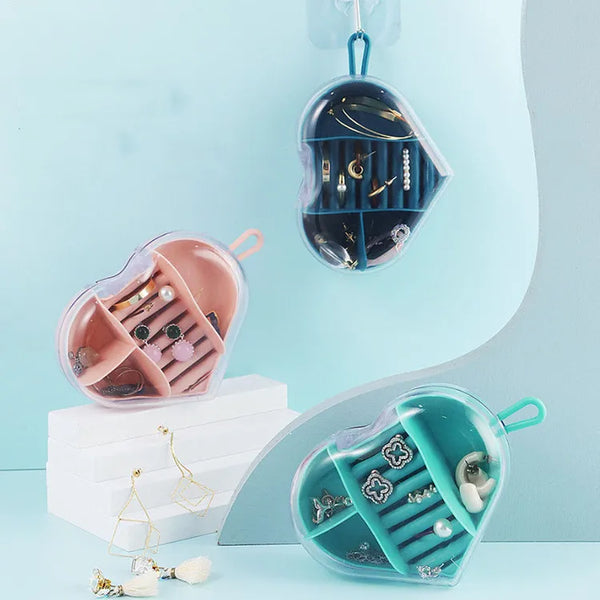Portable Heart-Shaped Acrylic Jewelry Storage Box in pastel colors with organized compartments for jewelry.