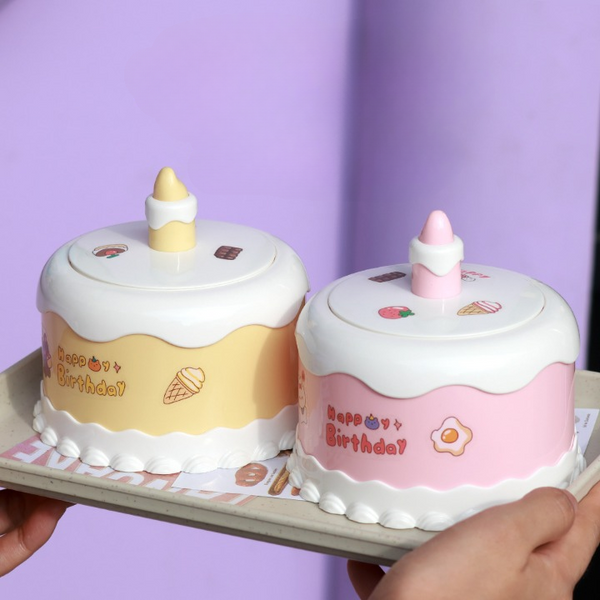 Portable LED Cake Desk Lamp displayed on a tray with playful birthday cake design and colorful decorations.