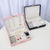 Premium Multi-Compartment Jewelry Box in pink and black, showcasing organized jewelry compartments for accessories.
