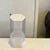 Rotating Hexagonal Acrylic Display Case featuring a 360-degree swivel and lockable design for collectibles.