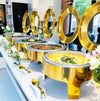 Stainless Steel Single Chafing Dish: Elegant display of stainless steel chafing dishes featuring warm food, perfect for buffets and catering.