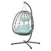 Indoor Outdoor Swing Egg Chair with stand, featuring a cozy design and soft blue cushions for relaxation.