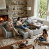 Family enjoying quality time on a 4 Seater Modular Fabric Sectional Sofa by the fireplace, with kids playing.