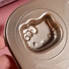 Close-up of Cartoon Character Non-Stick Baking Pan featuring a Hello Kitty design for themed baking.