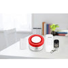 Smart Siren Alarm Home System with App displayed on a table, showcasing the siren and accessories.
