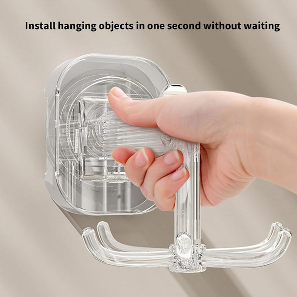 Hand demonstrating installation of suction cup wall hooks for storage on a smooth surface.