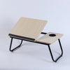 Folding Laptop Bed Desk with Cup Holder designed for comfortable workspace on sofa or bed.