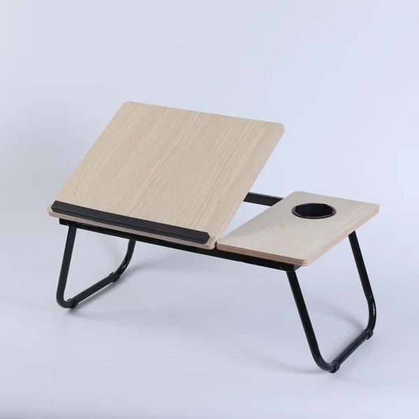 Folding Laptop Bed Desk with Cup Holder designed for comfortable workspace on sofa or bed.