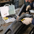 Man using 50W Plastic Welding Repair Stapler Kit to repair a cracked car bumper with stainless steel staples.