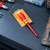1000V VDE Insulated Screwdriver PZ3 x 150mm displayed on a black workbench with tools.
