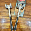 Double-Sided Stainless Steel Meat Tenderiser Hammer on wooden surface with packaging.