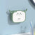 Wall-Mounted Kitchen Soap Dispenser in a playful, cute design mounted on a wall.