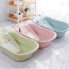 Baby Bath Tub Newborn Baby Thickened Large Tub in pastel colors: green, pink, and blue, with cute designs.