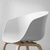 Modern White Dining Tub Chair showcasing a sleek polypropylene design with a wooden base.