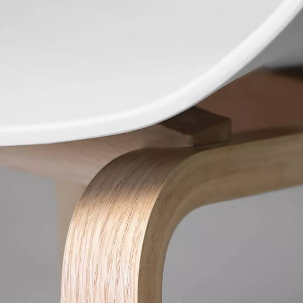 Modern White Dining Tub Chair with a smooth polypropylene seat and sturdy wooden base detail.