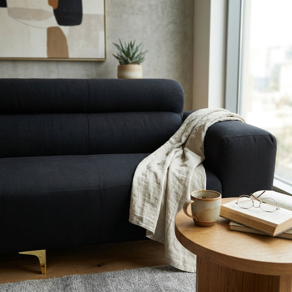 Modern Black 3-Seater Sofa with Gold Metal Legs elegantly styled in a contemporary living space with cozy decor.