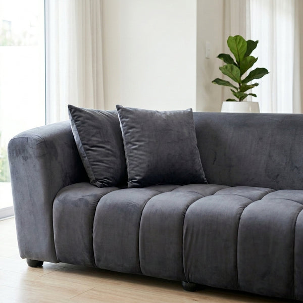 Modern Grey Upholstered 2-Seater Sofa featuring soft cushions and sleek design in a bright living room.