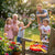 A family enjoying the Bubble Wand and Tray Set, playing with bubbles in a colorful garden setting.