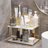 2-Tier Space-Saving Bathroom Rack holding various toiletries and skincare products on a stylish countertop.