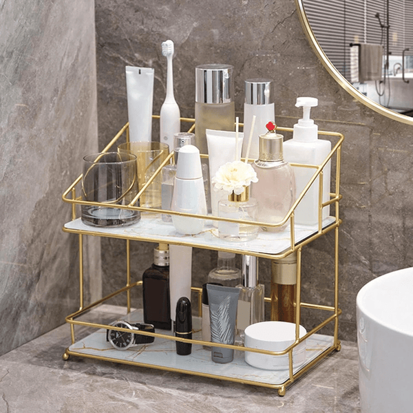 2-Tier Space-Saving Bathroom Rack holding various toiletries and skincare products on a stylish countertop.