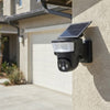 Solar-Powered Security Camera with Integrated LED Floodlight installed on a wall.