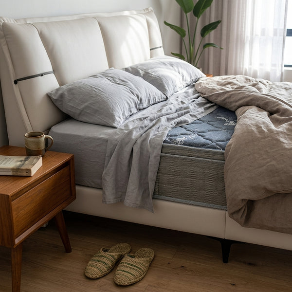 Modern Upholstered Bed Frame with soft bedding and stylish decor in a contemporary bedroom setting.